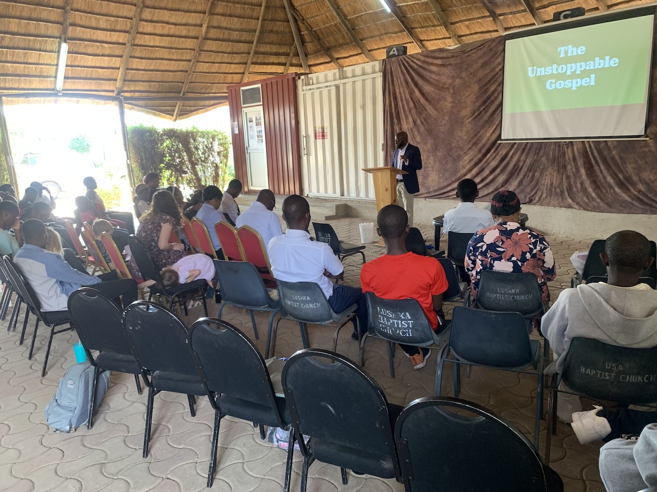 Rev Kayumba preaching